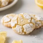 Lemon Crinkle Bliss: Soft, zesty cookies dusted with powdered sugar beside juicy lemon wedges—brighten snack time. Save this idea so you can come back to it later.