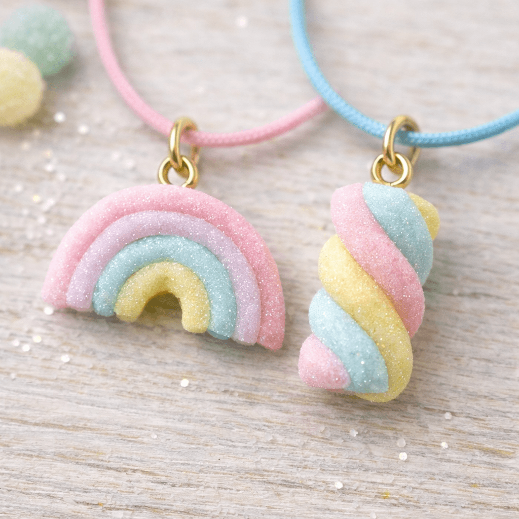 Pastel jelly rainbow charm made from twisted translucent clay in soft pink, blue, and yellow