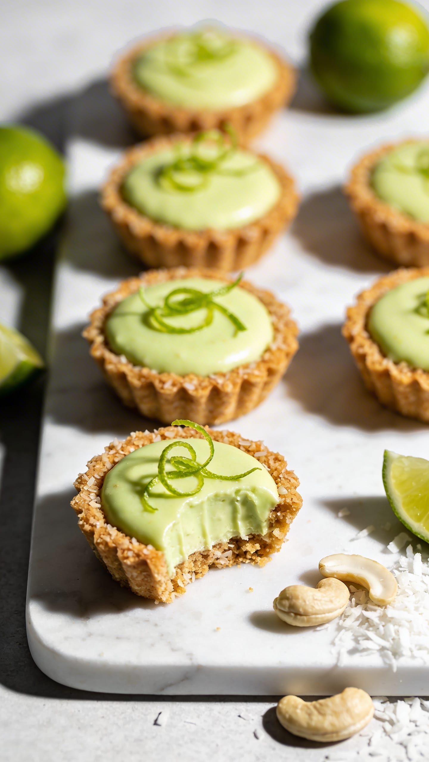 Vegan Key Lime Cheesecake Tarts: Creamy, zesty, plant-based minis with crumbly crust&mdash;perfect for healthy snacking. Save this idea so you can come back to it later.