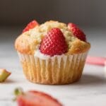 Strawberry Rhubarb Muffin Delight: Lush, golden vegan muffin with juicy fruit and glaze—perfect for spring brunch. Save this idea so you can come back to it later.