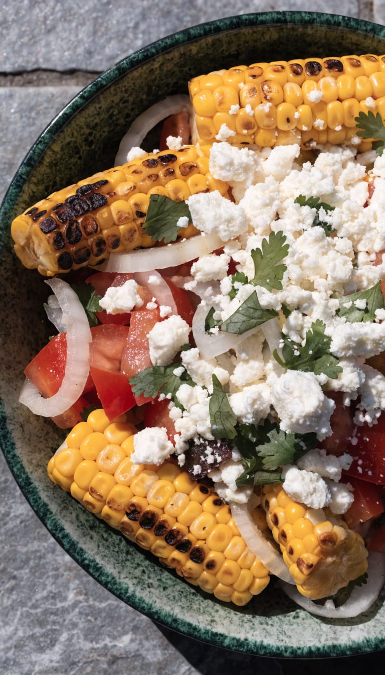 closeup bowl of Mexican street corn salad with cotija